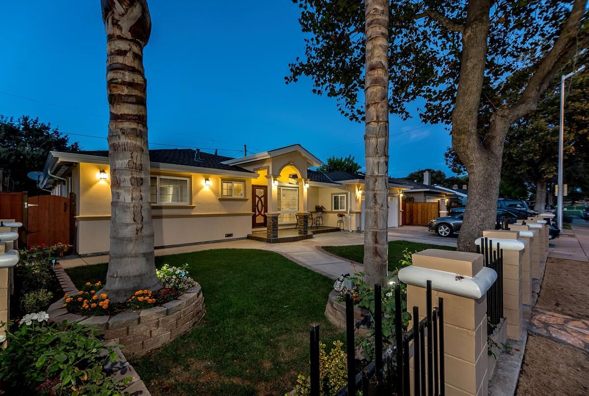 Custom home exterior at twilight built by JM Developers in the Bay Area