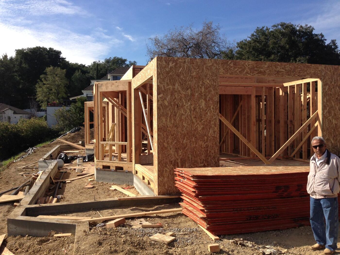 Ground-up wall framing on a hillside custom home build